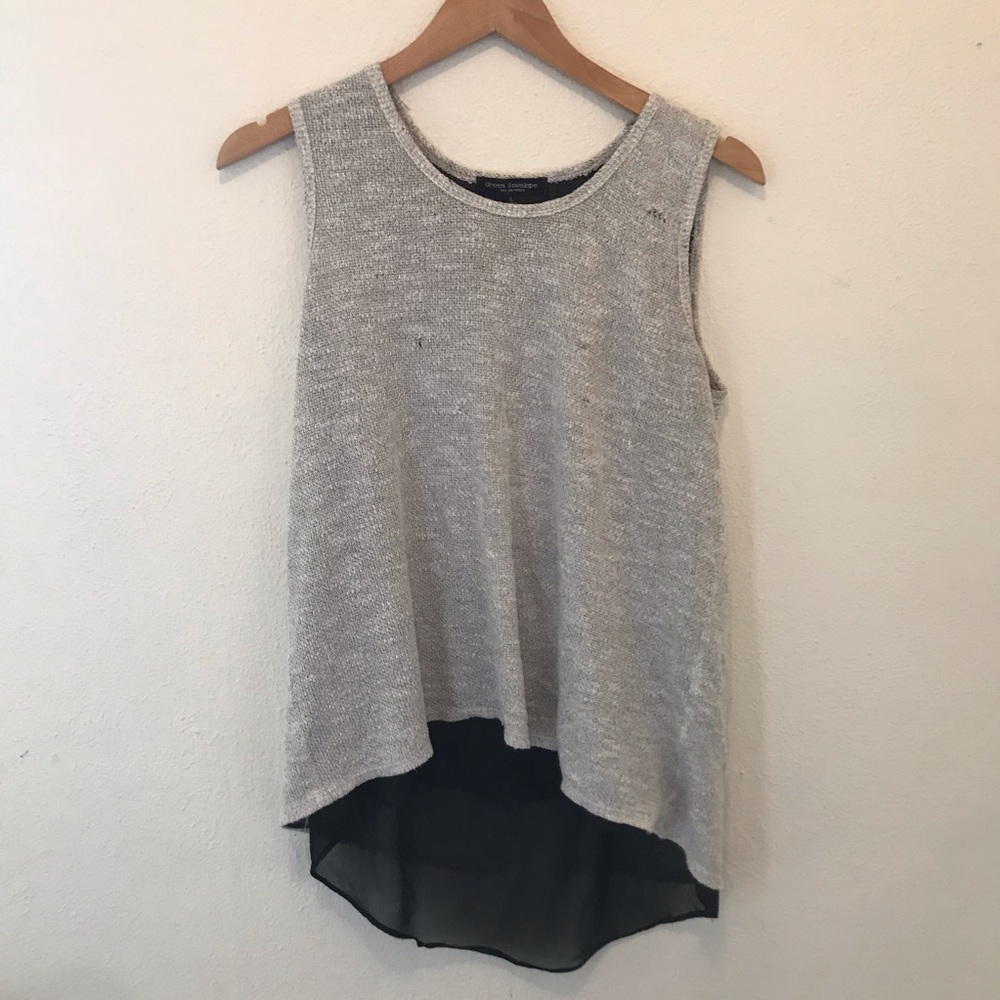 Gray knit tank with sheer black blouse underneath